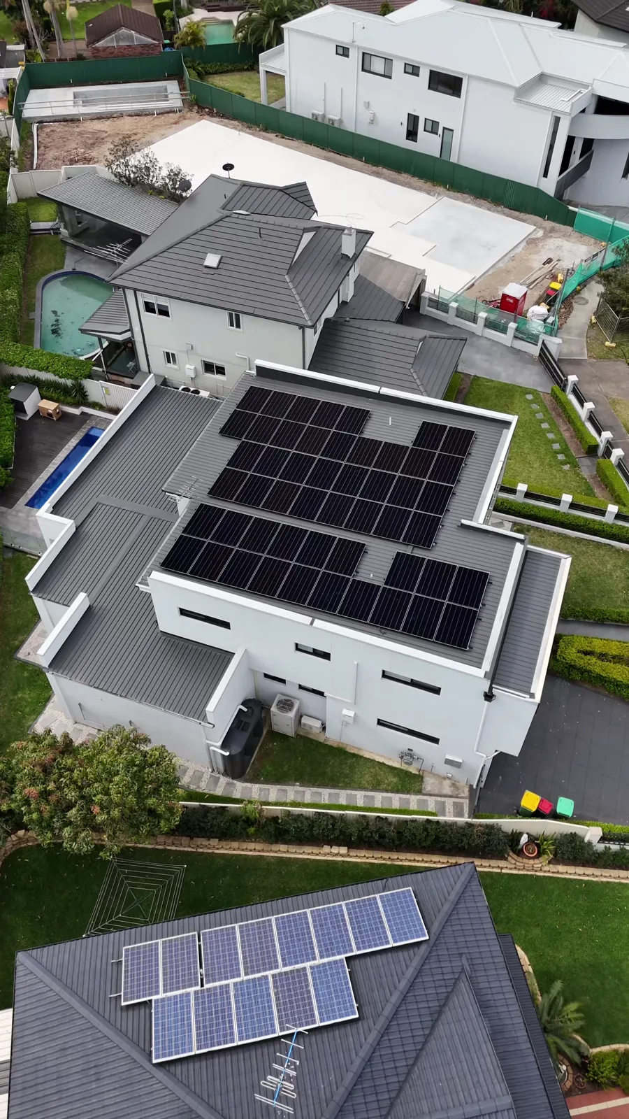 Drone view of a 51-panel solar system installed by Evolution Solar across the flat roof of a two-storey home