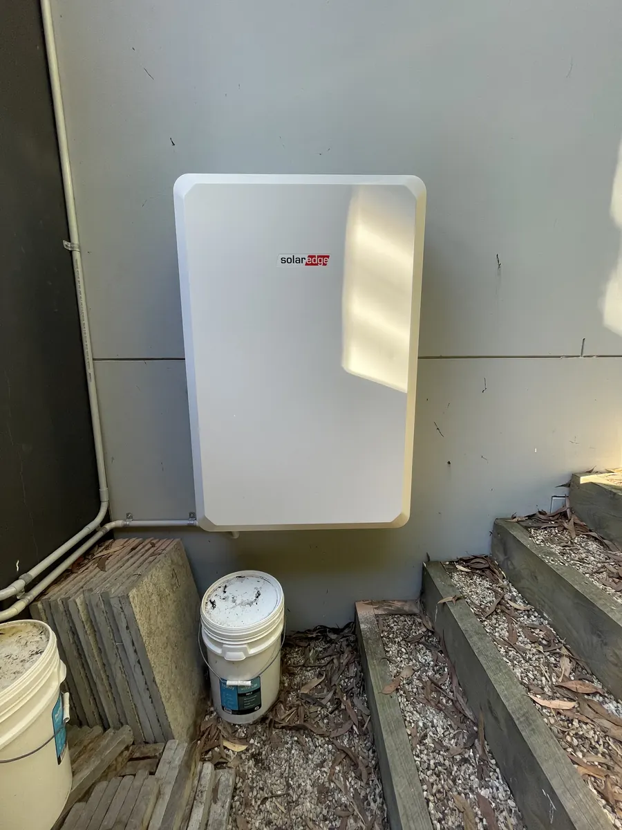 Home battery mounted on an outside wall